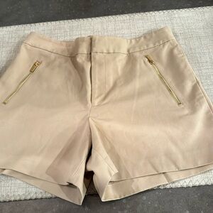BNWOT Calvin Klein khaki shorts size 6. Cute gold zip up pockets.